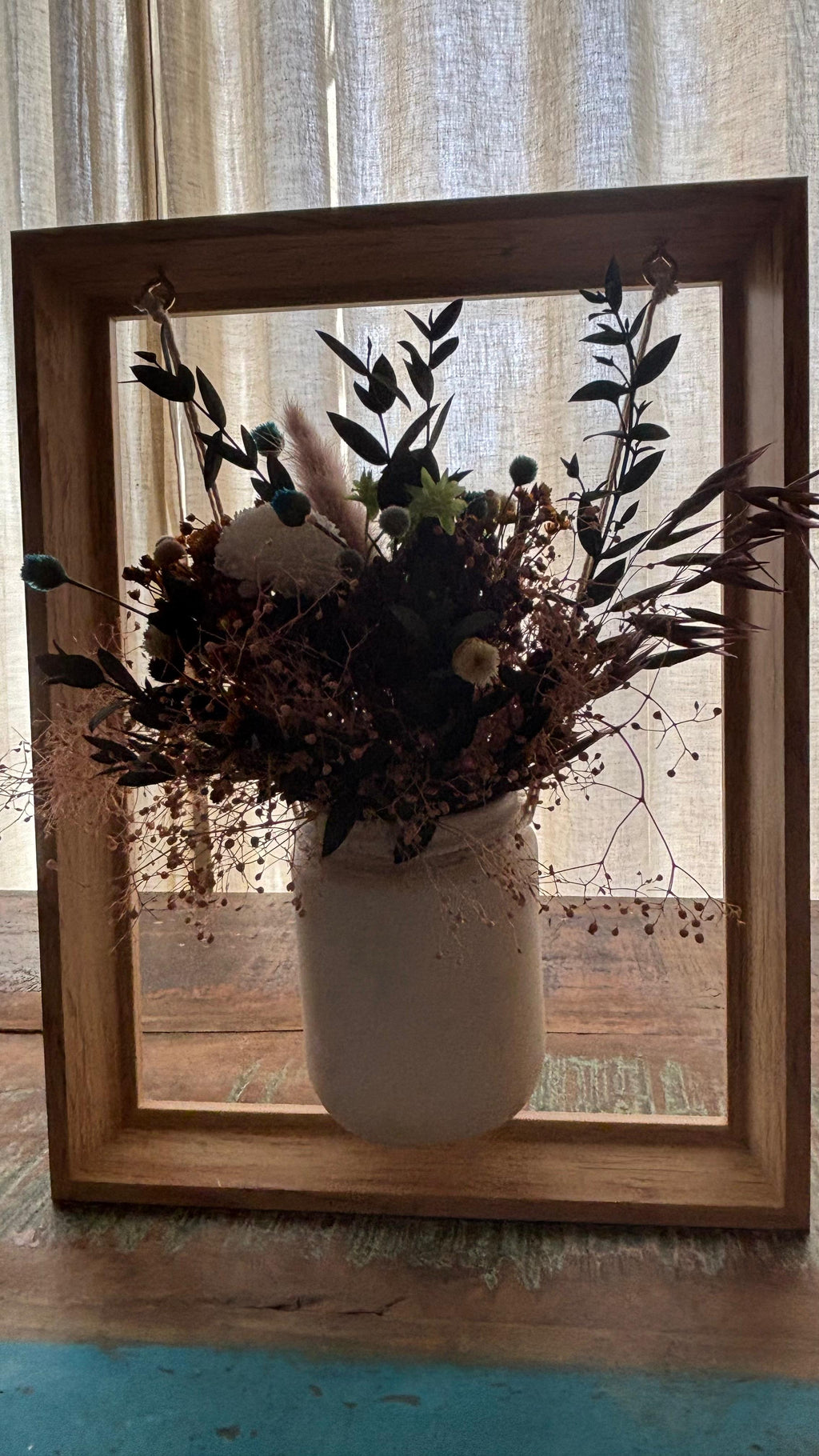 Centro colgante en marco de madera